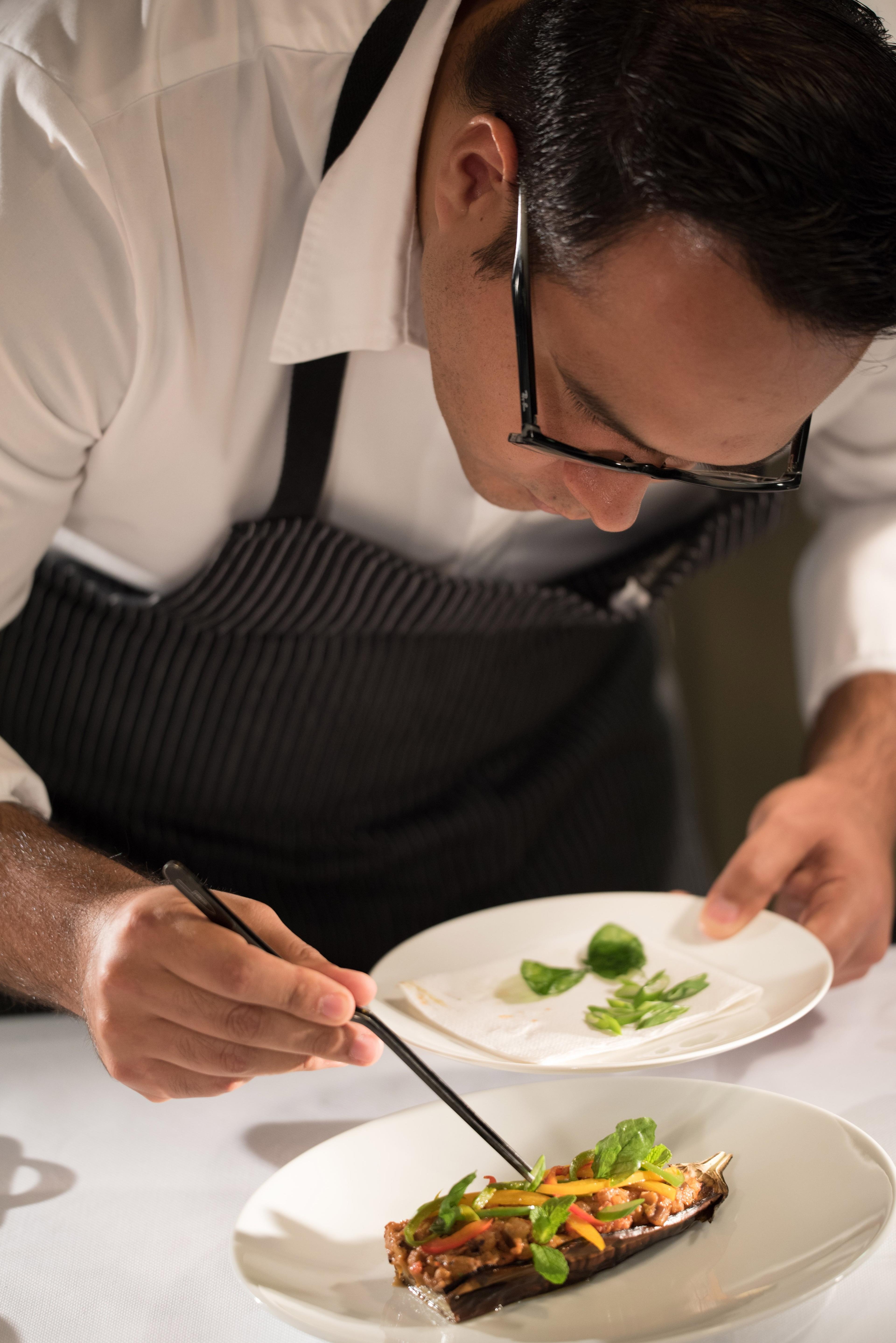 Chef Amaka preparing a signature dish